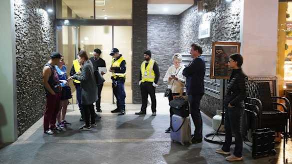 Residents evacuating the building on Friday night after receiving a letter from the building manager saying they had until 9pm to vacate the complex.