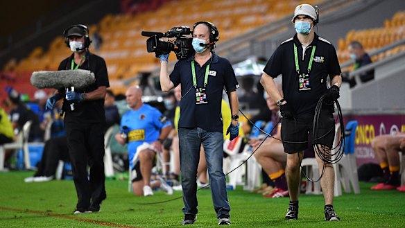 Broadcast personnel at Suncorp Stadium on Thursday night.