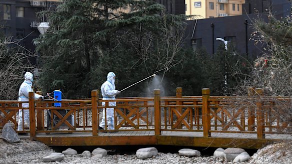 Chinese state media are warning people not to overreact to new infections. 