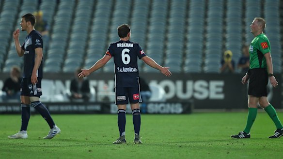No joy: Victory's Leigh Broxham appeals to the referee after conceding a penalty.