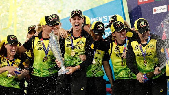 The Australian team celebrate their win over India on Sunday night.