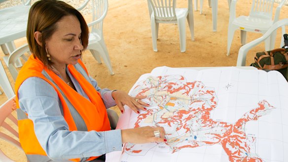 Renova Resettlement Manager Patricia Lois, left, at the site of the new Bento.