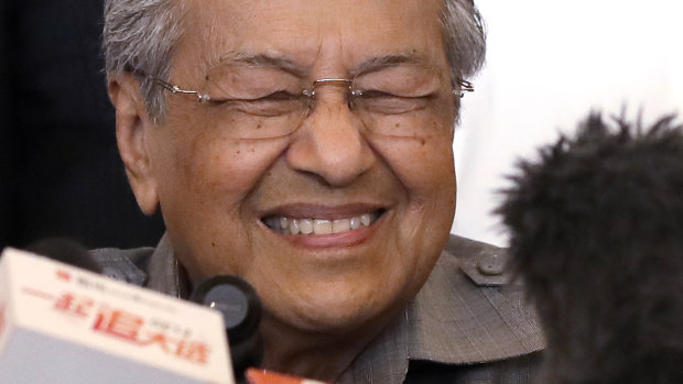 Mahathir Mohamad tells the media he has a clear mandate to form a new government in Malaysia.