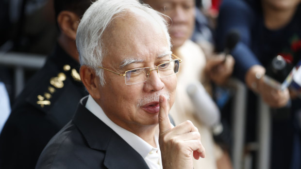 Former Malaysian prime minister Najib Razak gestures as he leaves the Malaysian Anti-Corruption Commission (MACC) Office in Putrajaya last Thursday.