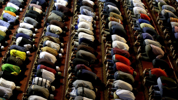 Muslims in Indonesia perform an afternoon prayer during Ramadan. 