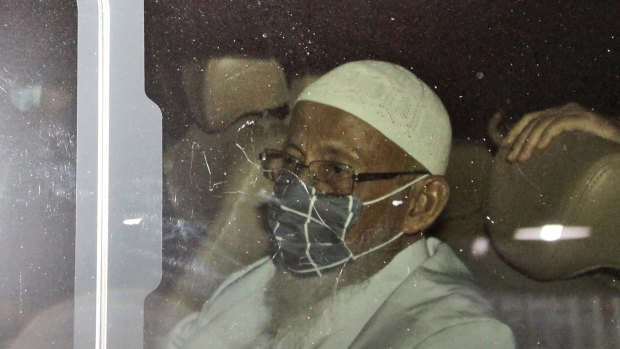 Islamist cleric Abu Bakar Bashir sits inside a van as he leaves Gunung Sindur Prison in Bogor, West Java, Indonesia, on Friday.