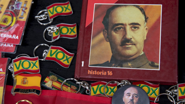 Souvenirs are for sale with Francoist symbology next to key chains of far right wing Vox party during a rally commemorating the 44th anniversary of Spain's former dictator General Francisco Franco's death in Madrid, 