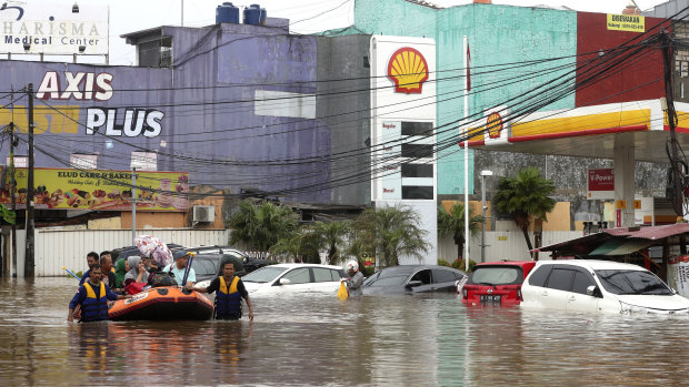 Severe flooding hit Indonesia's capital as residents were celebrating New Year's Eve. More extreme weather is forecast.