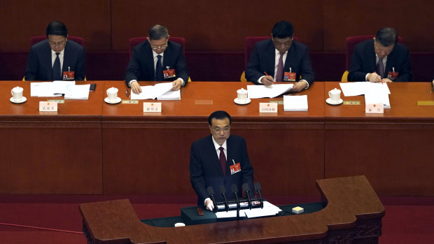 Chinese Premier Li Keqiang delivers a speech during the opening session of China’s National People’s Congress (NPC) at the Great Hall of the People in Beijing.