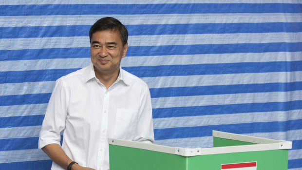 Democrat Party leader Abhisit Vejjajiva casts his vote at a polling station in Bangkok on Sunday. He has since quit after his party's poor showing.