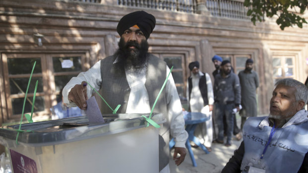 A man from the minority Sikh casts his vote in Parliamentary elections in old city of Kabul, Afghanistan, on Saturday.