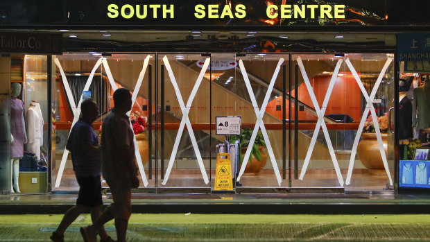 The glass doors of a Hong Kong shopping centre, taped as a precaution against typhoon Saola.