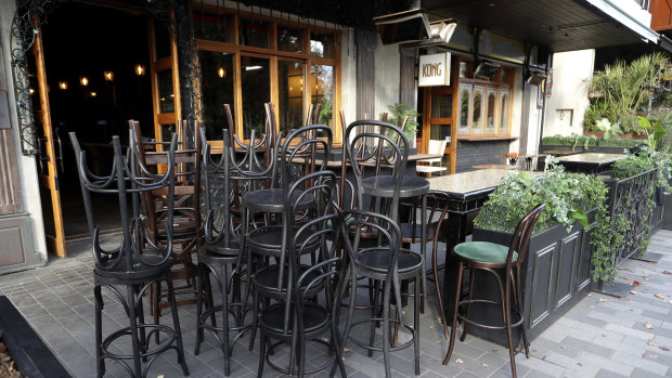 Bar stools are stacked outside a bar in Christchurch, New Zealand.