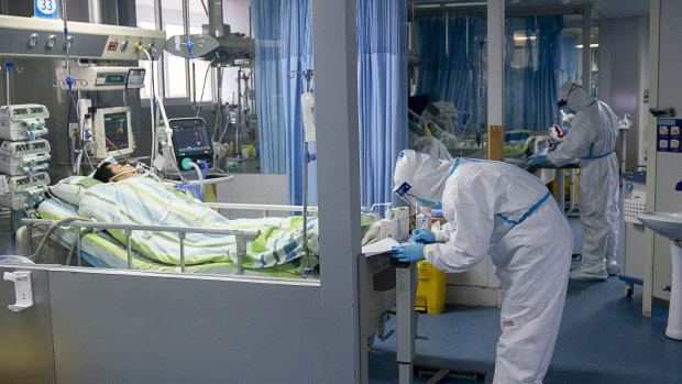 A medical worker attends to a patient in the intensive care unit at Zhongnan Hospital of Wuhan University in January 2020.