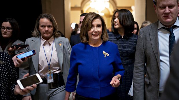 US House Speaker Nancy Pelosi, a Democrat from California, walks though the US Capitol on Thursday. She will send the articles of impeachment to the Senate on Monday.