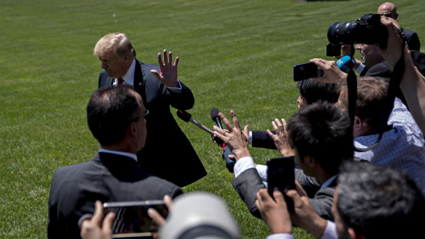 Donald Trump finishes speaking to the media before flying to Japan.