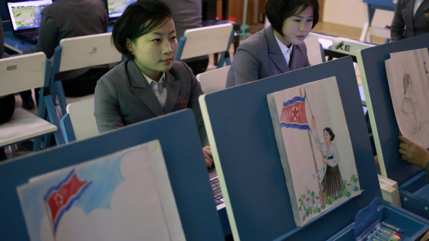 Students make drawings of North Korean flags during class at Pyongyang Teachers' University in Pyongyang last week.