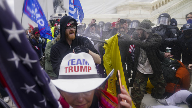 Trump supporters trying to break through a police barrier at the Capitol on January 6.