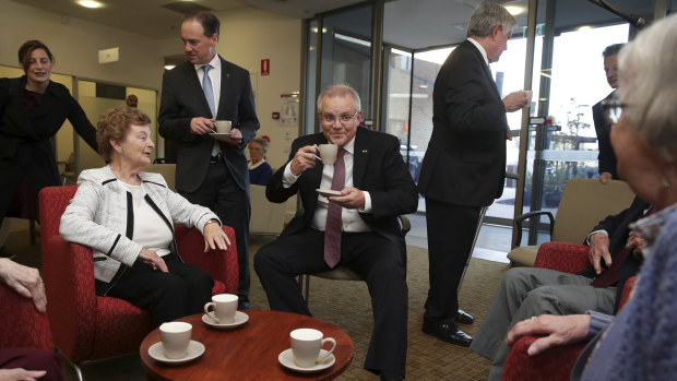 Prime Minister Scott Morrison visits the Goodwin Retirement Village in Canberra with ministers Greg Hunt and Ken Wyatt.