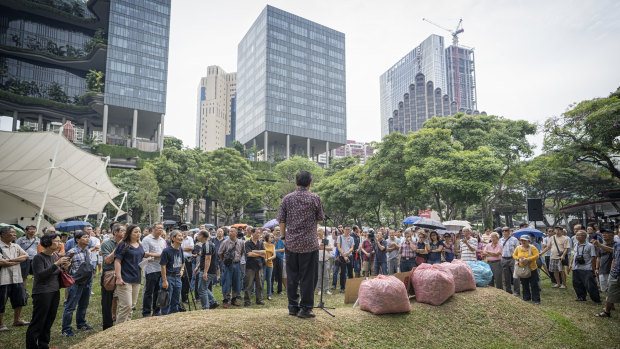 People gather to listen to a speaker during a protest on Hyflux Ltd. debt restructuring plan in Singapore.