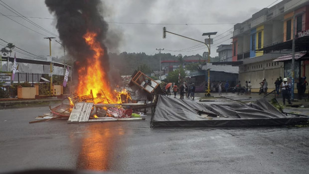 Fires burn during a violent protest in Manokwari, Papua province, Indonesia, Monday.