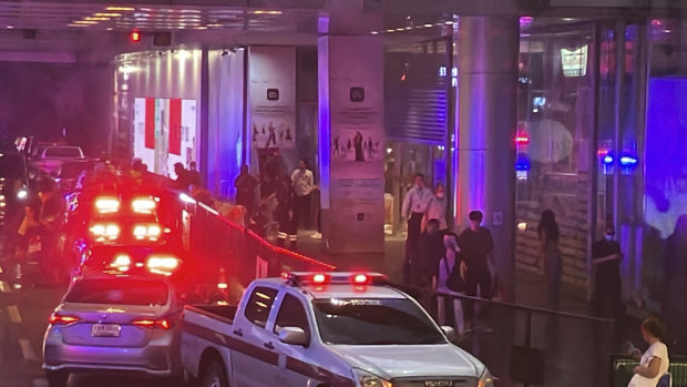 Ambulances wait outside a mall in Bangkok, the scene of a fatal shooting.