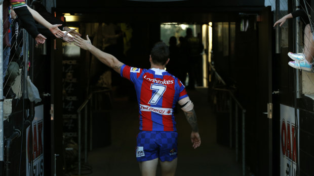Satisfaction: Mitchell Pearce heads to the sheds after steering the Knights to victory.