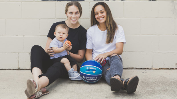 Mikaela Dombkins and her partner Canberra Capitals guard Leilani Mitchell with their son Kash Mitchell-Dombkins.