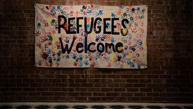 A Refugees Welcome banner hangs at the International Rescue Committee.