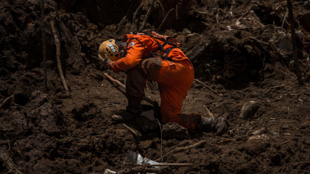 A rescue worker surveys damage after a Vale SA dam burst in Brumadinho, Minas Gerais state, Brazil, last month.