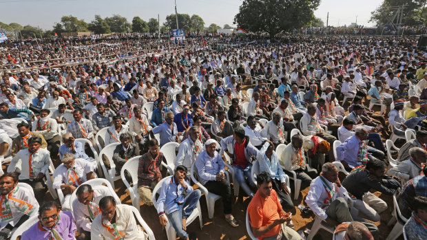 People attend a Rally for Rahul Gandhi in 2017. He's promising to provide a minimum income "for every person".