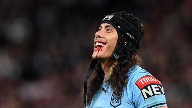 Jarome Luai smiles at the Queensland fans after getting his marching orders at Suncorp Stadium.