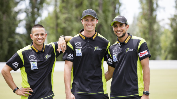 Sydney Thunder players Usman Khawaja, Jay Lenton and Jason Sangha at Canberra Grammar School on Friday.