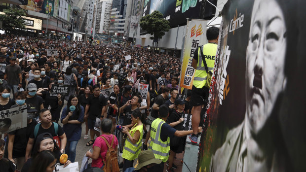 Protesters pack central Hong Kong, defying police. 