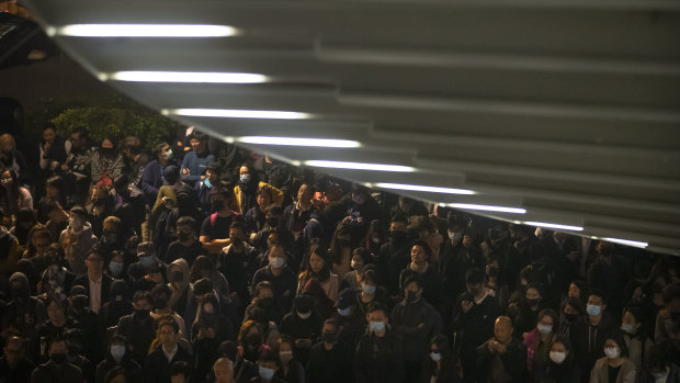 Protesters gather during a rally in commemoration of International Human Rights Day outside of the Legislative Council offices in Hong Kong on Tuesday.