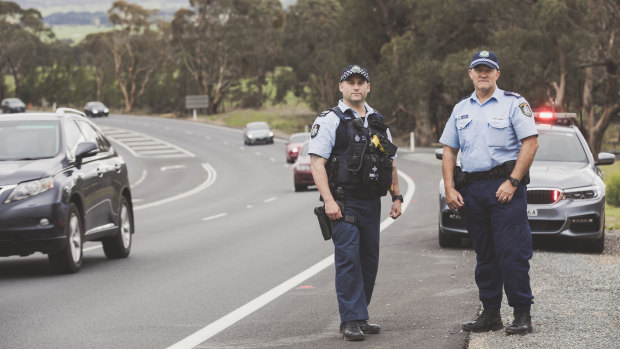ACT Policing's Dave Wills and NSW Police's Angus Duncombe on the Kings Highway.