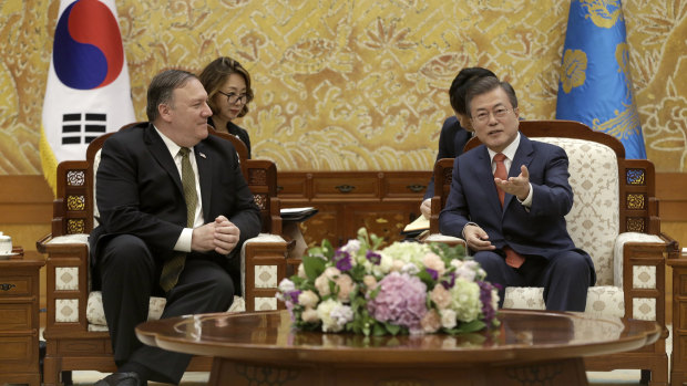 South Korean President Moon Jae-in, right, talks with US Secretary of State Mike Pompeo at the presidential Blue House in Seoul, South Korea, on Sunday.