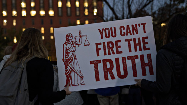 Demonstrators, calling for the recusal of acting Attorney General Matthew Whitaker in overseeing Special Counsel Robert Mueller, holds a "You Can't Fire The Truth" sign outside the White House in Washington, DC.