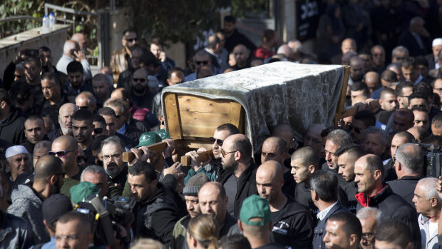 Relatives and friends carry the coffin of Aiia Maasarwe through the city of Baqa El Gharbiye, Israel.