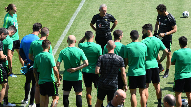 This is it: Bert van Marwijk and the Socceroos players go through final preparations for the Peru match.