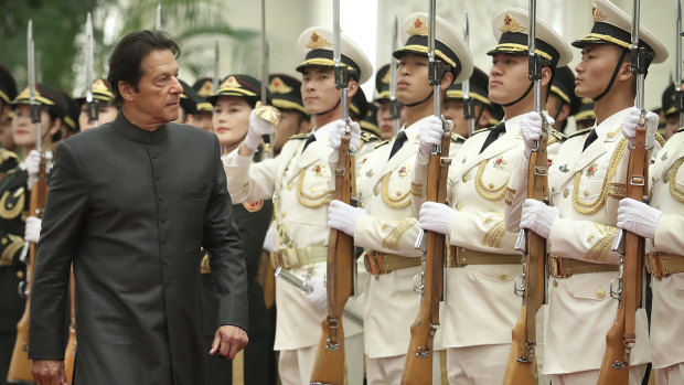 Pakistan's Prime Minister Imran Khan reviews the troops during a visit to Beijing last month.