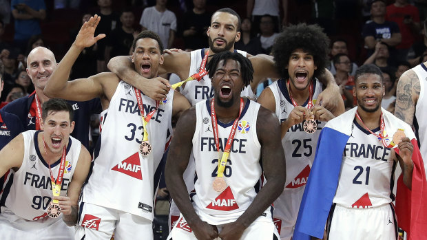 French players celebrate with their bronze medals after the play-off win over Australia.