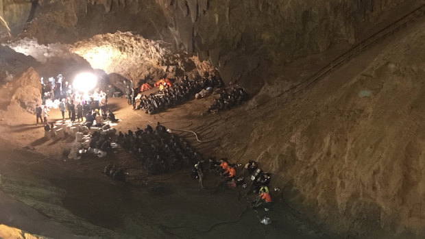 Emergency rescue teams search for a young soccer team and their coach missing in a large cave complex in Thailand.