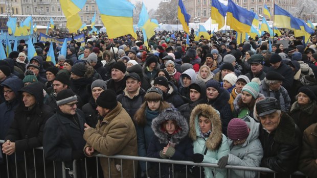 People with Ukrainian national flags gathered to support independent Ukrainian church near the St Sophia Cathedral in Kiev, Ukraine.