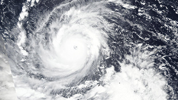 Typhoon Mangkhut churns west towards the Philippines.