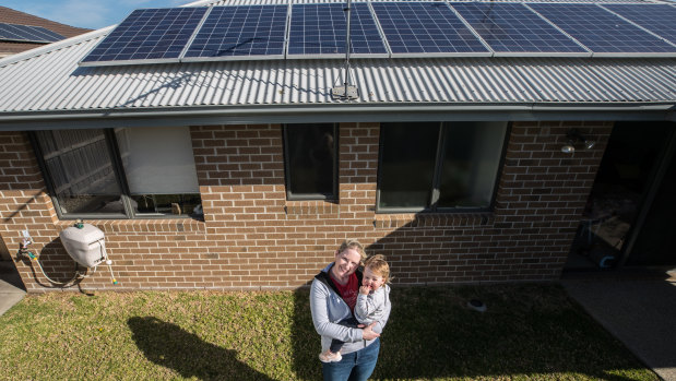 Gemma Cook, with daughter Mia, says the Andrews government's solar pitch is enticing.