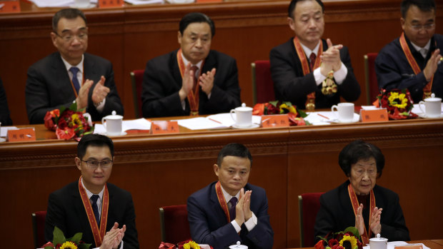 Jack Ma (bottom row centre), chairman of Chinese e-commerce firm Alibaba Group, was among the entrepreneurs honoured at the event. 