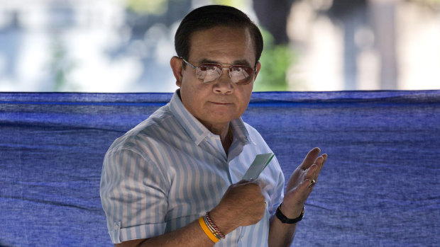 Thailand's Prime Minister Prayuth Chan-ocha casts a vote for himself.