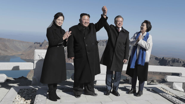 A life-long dream: South Korean President Moon Jae-in, second from right, and his wife Kim Jung-sook, right, stand with North Korean leader Kim Jong-un, and his wife Ri Sol Ju on the Mount Paektu.