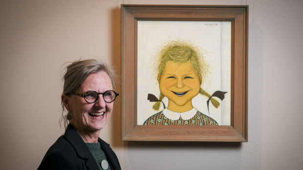 Charlotte Brack (daughter of artist John Brack) with his portrait of her.